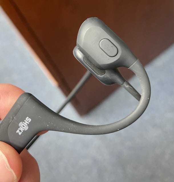 Multi-function button on headphones